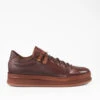 COLE Cognac Welted Distressed Loop Sneakers.