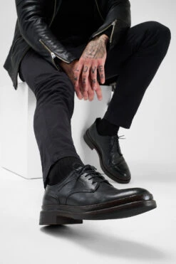 LAMBETH Jet-black Welted Derby Shoes. -Untamedstreet Shop Men wearing LAMBETH jet black welted derby leather shoes 241497