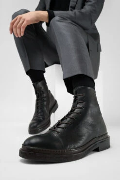 YALE Matte-black Welted Oxford Lace Up Boots. 18 YALE Matte-black Welted Oxford Lace Up Boots. -Untamedstreet Shop Model wearing YALE tuxedo black welted derby lace up leather boots 241992