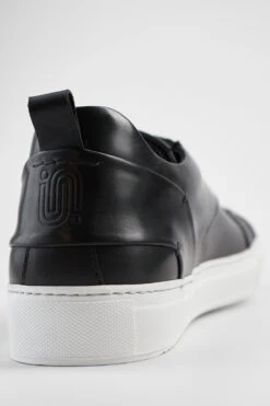 SKYE Tuxedo-black Studded Sneakers. -Untamedstreet Shop SKYESTUDlowtuxedo black sneakers trainers patinaleather untamedstreet madeinitalyMACROSSNEAKERS02177